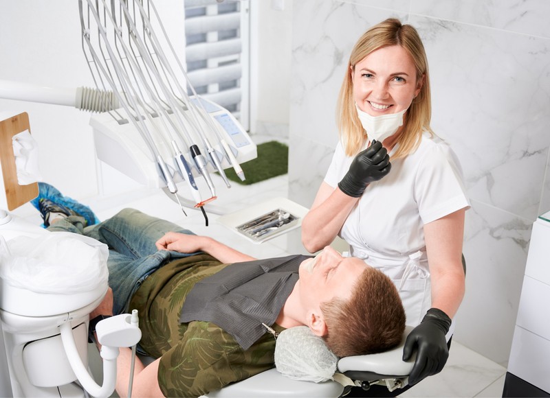 a dentist with a patient in a dental office