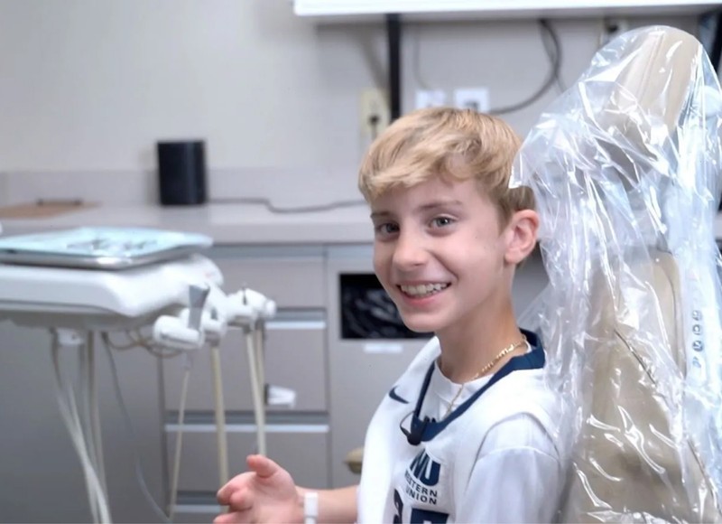 teenager getting invisalign in doctor's office